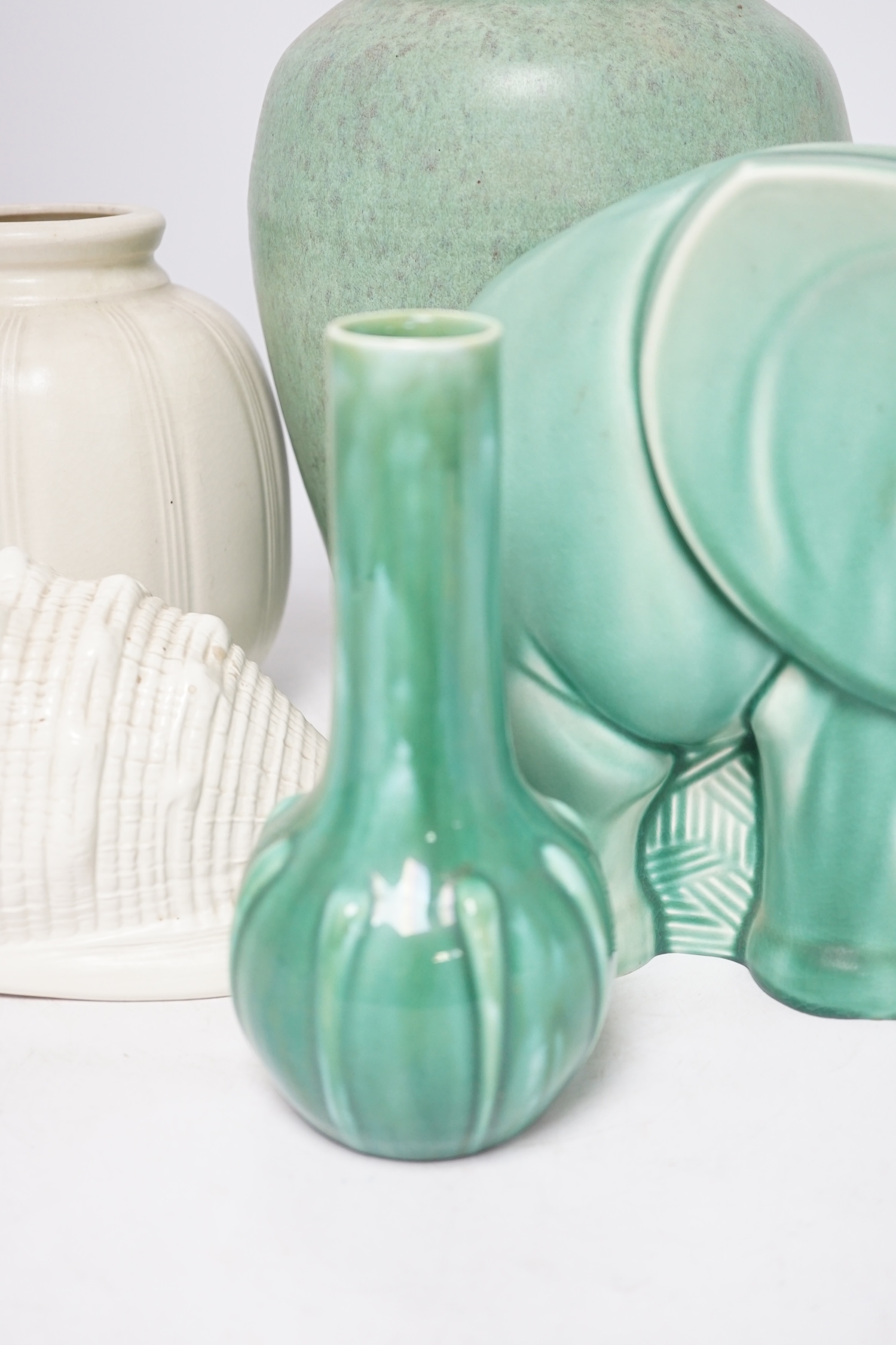 An Art Deco Spode's Royal Jade green glazed model of an elephant and four other pieces of Poole, Royal Lancastrian and Wedgwood, tallest 29cm. Condition - good